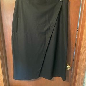 Eileen Fisher black wool ‘wrap’ skirt with button detail. Eco-friendly wool.